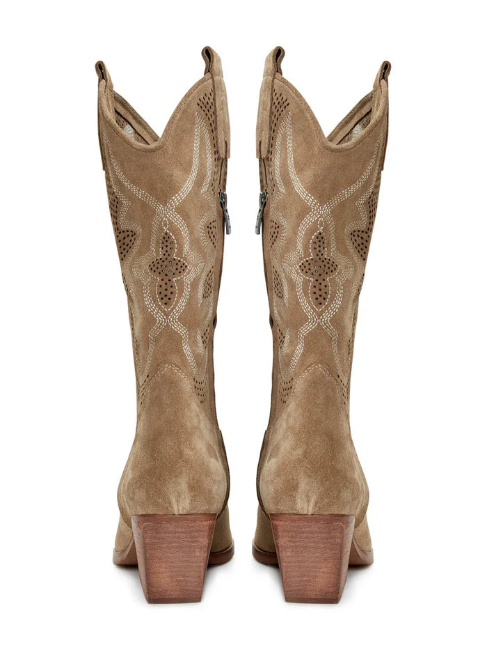 A pair of light brown, handcrafted leather cowboy boots with intricate embroidery, showcasing a unique Western style footwear design.