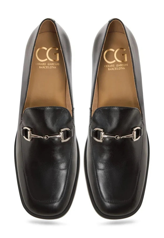 A stylish pair of black equestrian chic loafers, perfect for a fashionable and trendy equestrian footwear look.