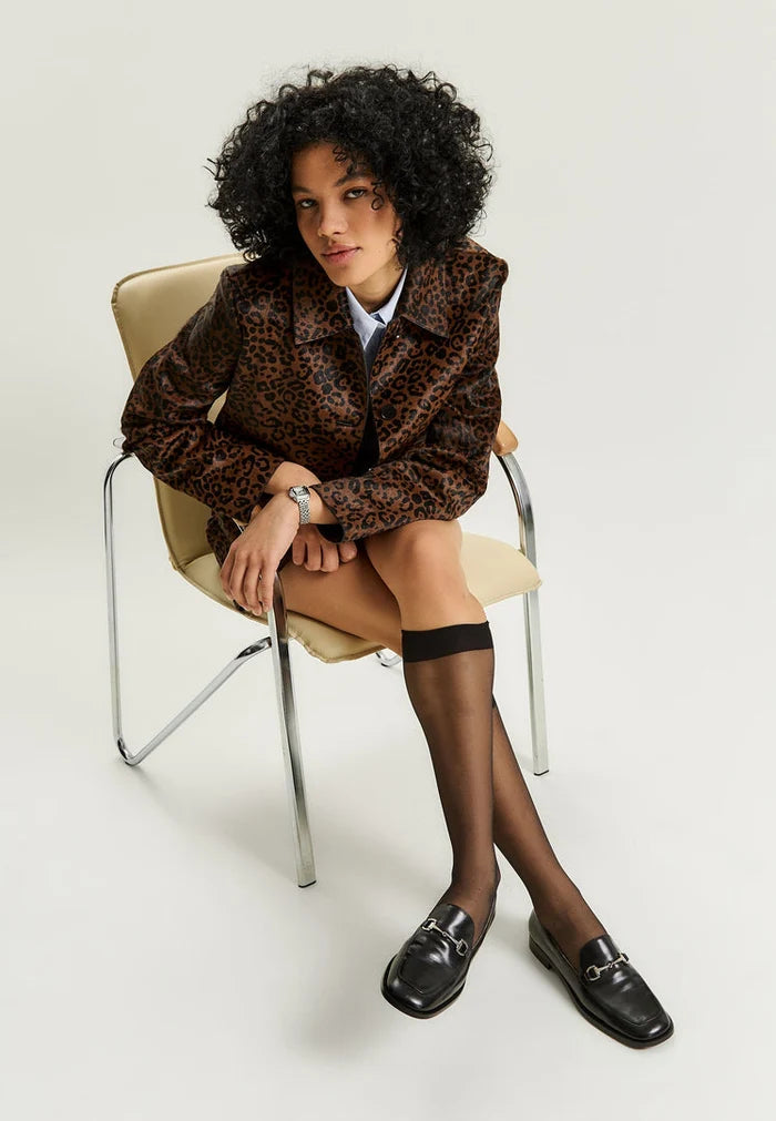 A stylish pair of black equestrian chic loafers, perfect for those who love fashionable and trendy equestrian footwear.