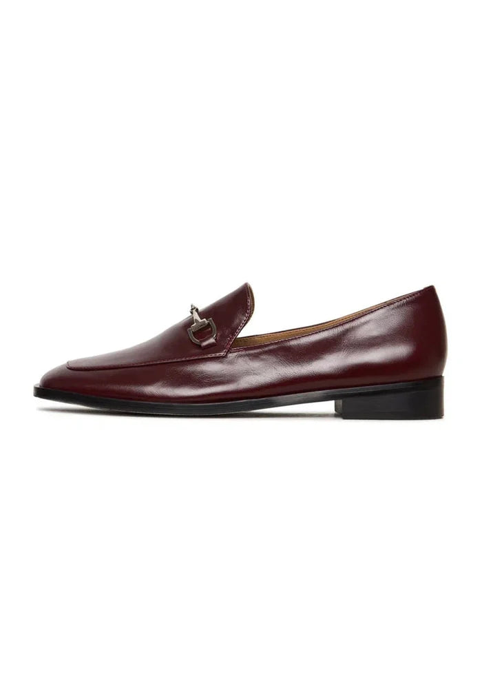 A pair of stylish equestrian chic Bordeaux loafers, the perfect fashionable equestrian footwear.