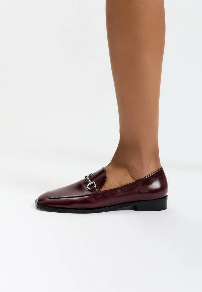 A sophisticated pair of equestrian chic Bordeaux loafers, the perfect blend of stylish and fashionable equestrian footwear.