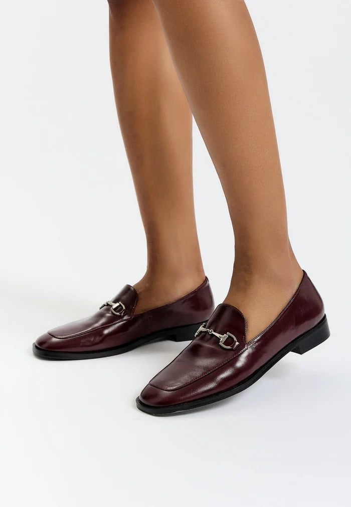 A trendy pair of Bordeaux loafers that perfectly blend equestrian chic style with fashion-forward design, ideal for those looking for stylish and fashionable equestrian footwear.