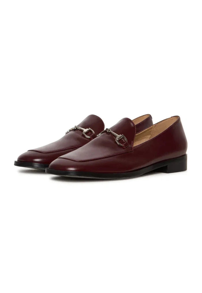 A stylish pair of Bordeaux loafers, perfect for the equestrian chic look with fashionable equestrian footwear vibes.