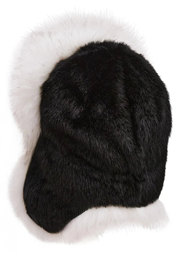 Stylish black and white faux fur hat, perfect for winter fashion.