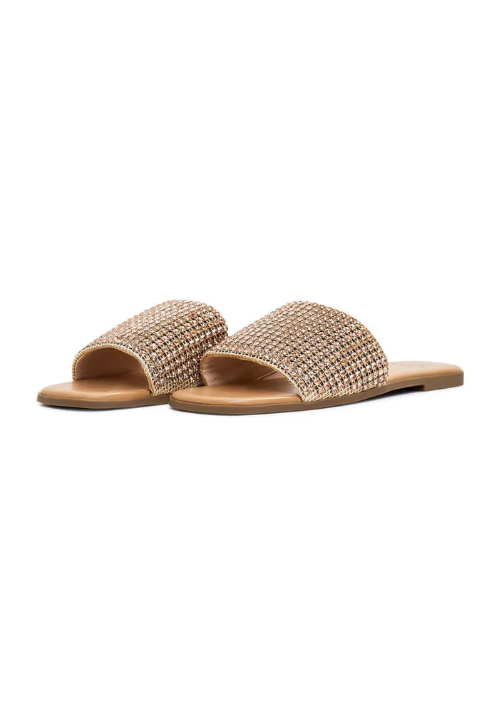A pair of luxurious gold Izzy flat sole women's slippers, known for their comfort and style.
