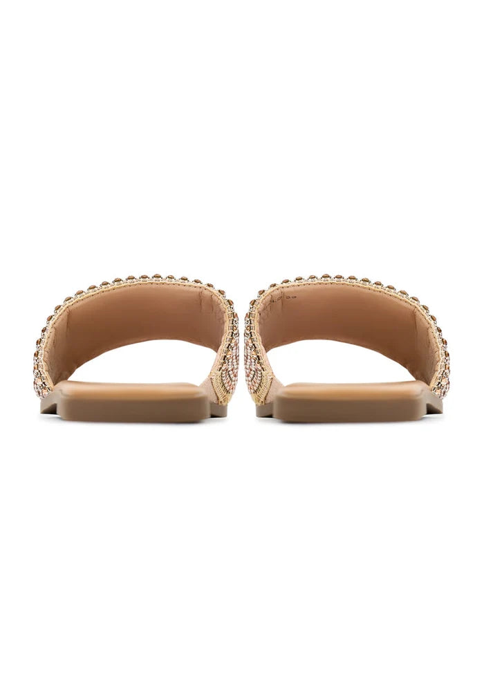 A stylish pair of gold Izzy flat sole women's slippers, perfect for a comfortable and stylish look.