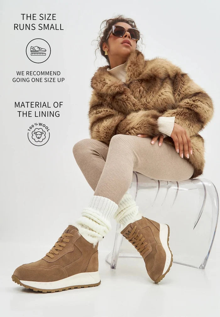 A pair of stylish brown winter boots with a flat sole, perfect for cold weather and winter fashion footwear.