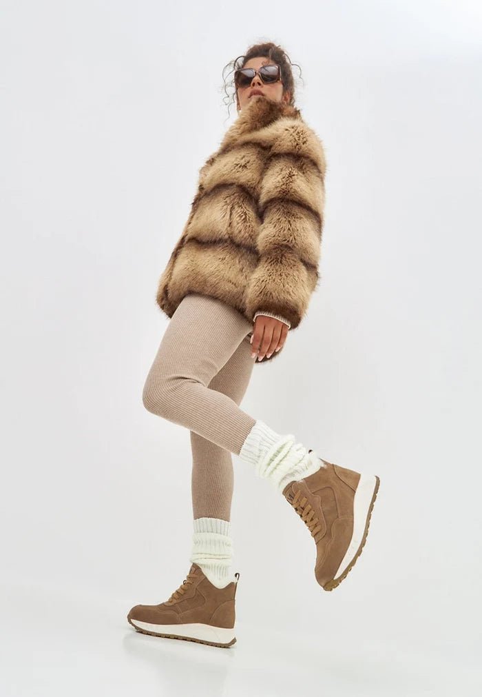A pair of stylish brown flat sole winter boots, perfect for cold weather, featuring a trendy winter fashion footwear design.