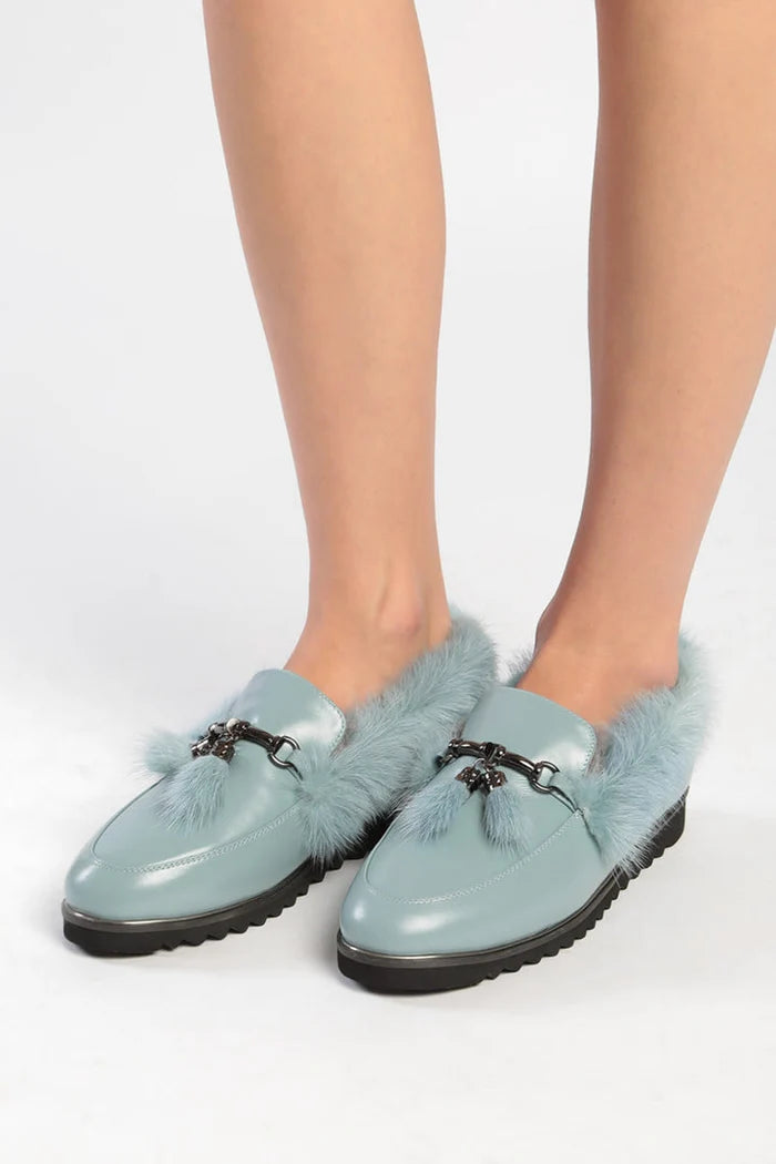 A cozy pair of Frost Charm Fur Loafers for women, perfect for the winter season. Stay stylish and warm in these cold weather fur shoes.