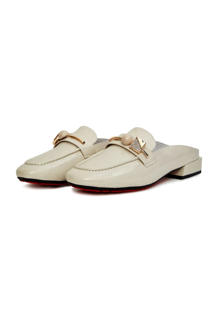 A stylish pair of white mule shoes with glossy charm, perfect for adding elegance to any outfit.