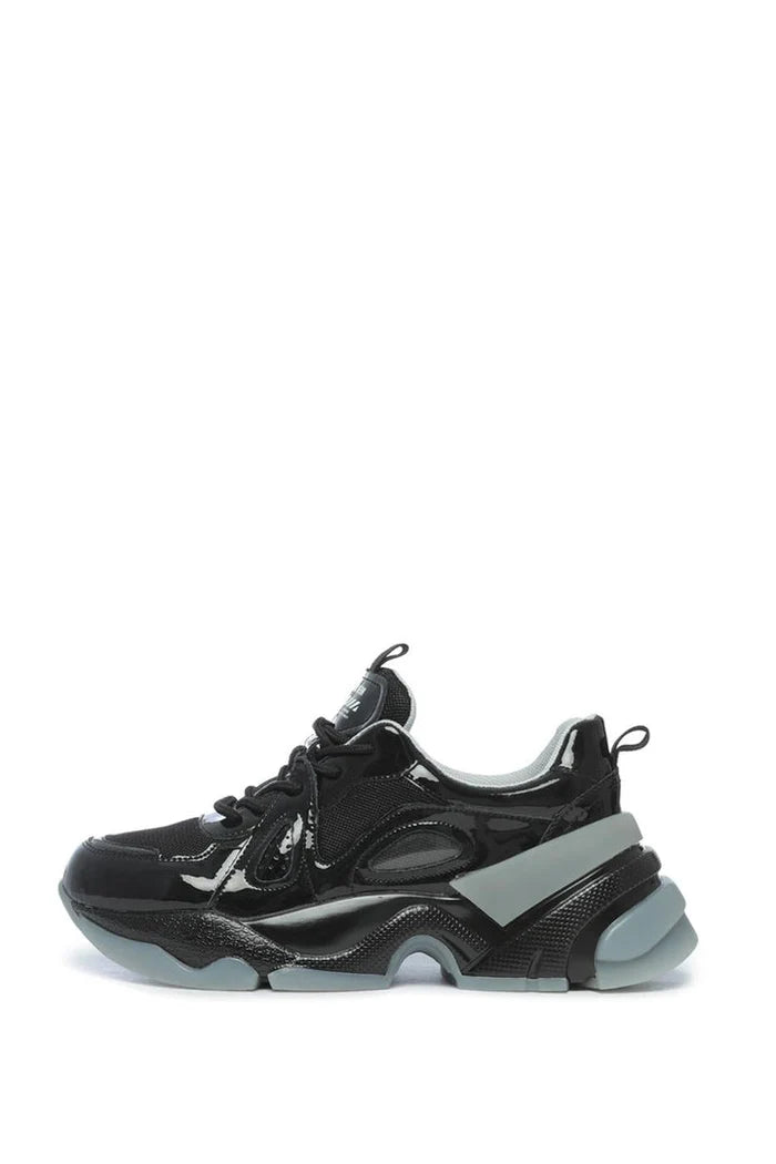 A pair of trendy fashion sneakers with a chunky sole and glossy finish, perfect for adding some height and style with platform design.