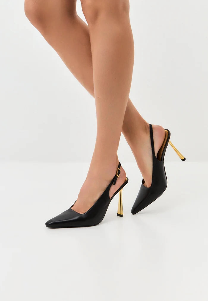 A stunning pair of women's heels in golden hour, embodying luxury and style with trendy pumps - the epitome of exclusive shoes.