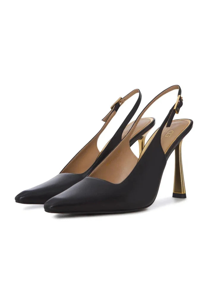 A pair of stylish women's heels in the golden hour light, showcasing luxury footwear with trendy pumps, exclusive shoes for fashion-forward individuals.