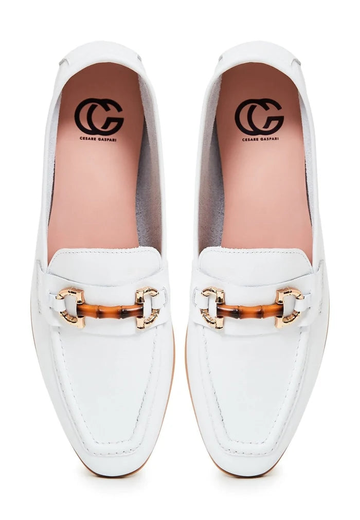 A pair of high-quality leather loafers in white, perfect for fashionable individuals seeking designer shoes.