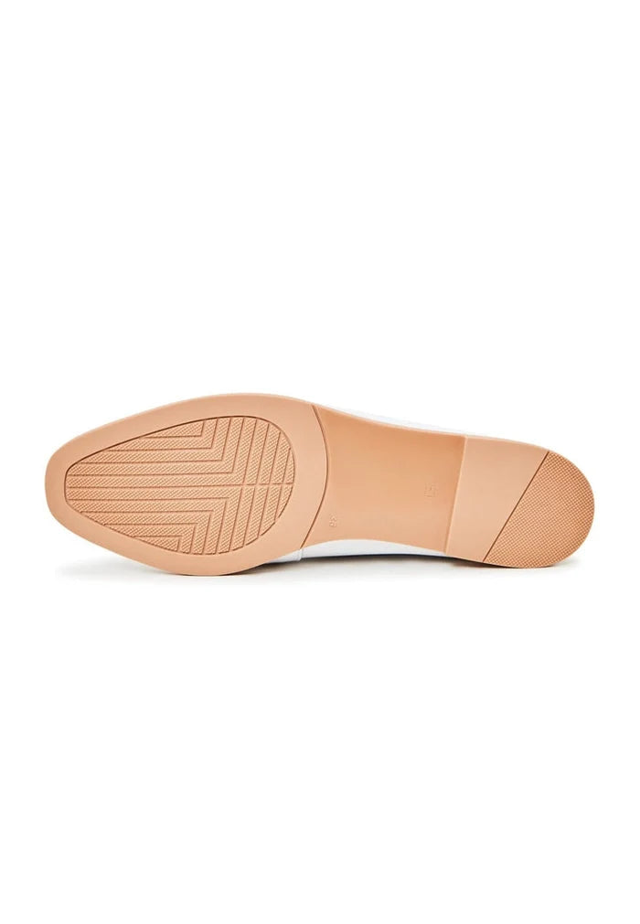 A pair of high-quality leather loafers in white, designer shoes for a sophisticated look.