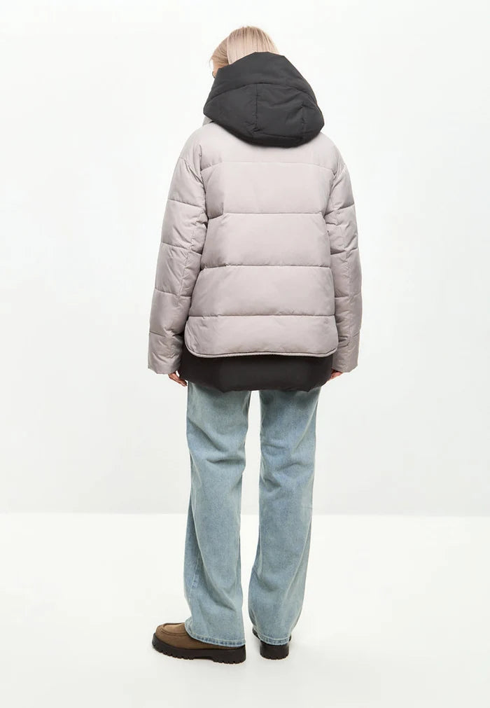 A stylish beige hooded puffer jacket, the perfect winter coat for women's outerwear fashion.