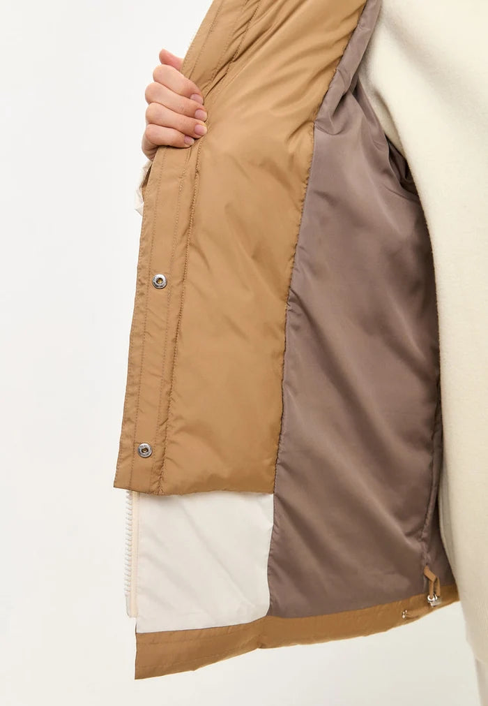 A stylish white hooded puffer jacket for the winter season, perfect for staying warm and fashionable in the snow - a must-have in outerwear fashion.