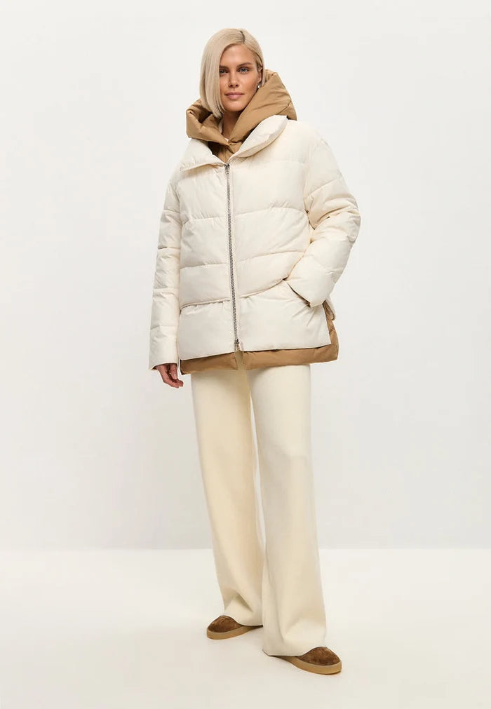 A stylish white hooded puffer jacket perfect for winter, featuring a sleek design that blends fashion and functionality in outerwear.