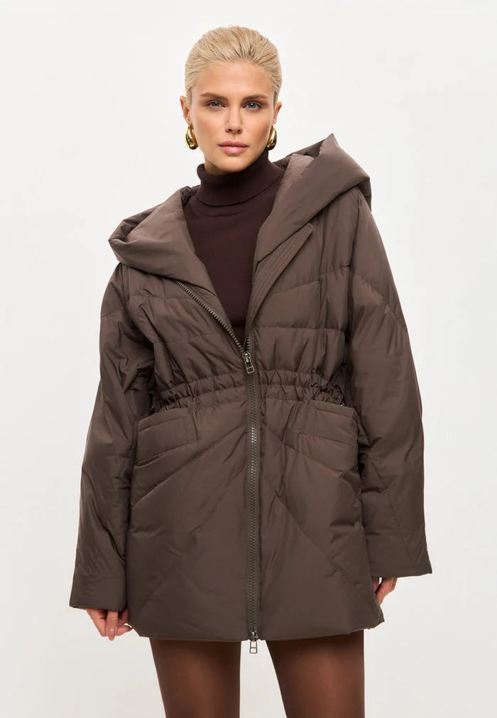 A stylish women's brown hooded quilted jacket, the perfect winter fashion outerwear piece.