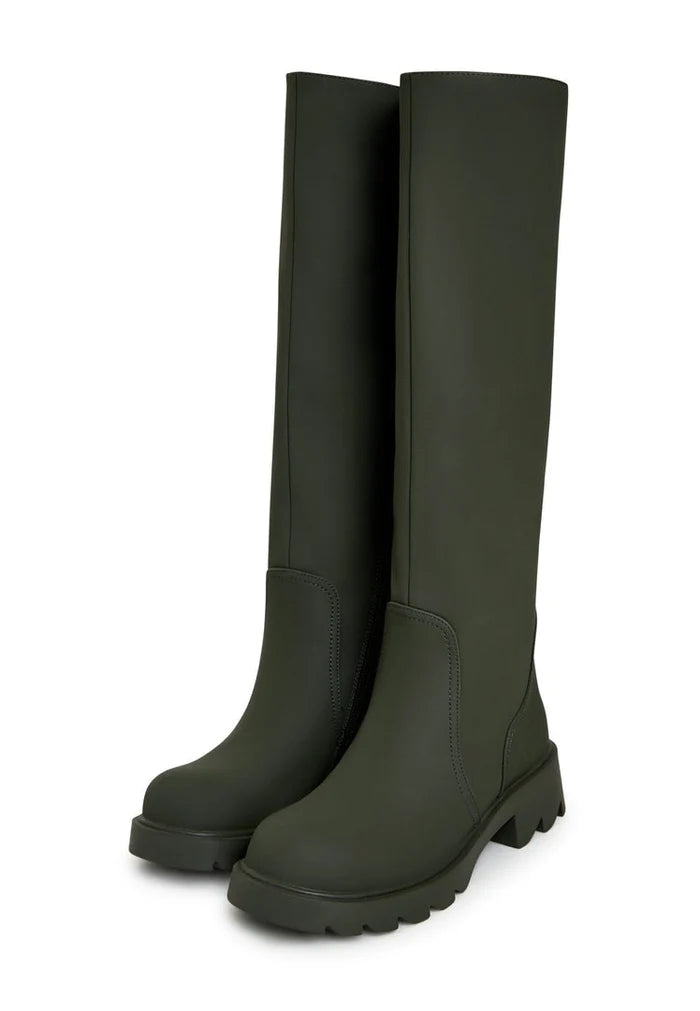 A pair of trendy green knee-high boots with chunky soles, perfect for women's fashion footwear.