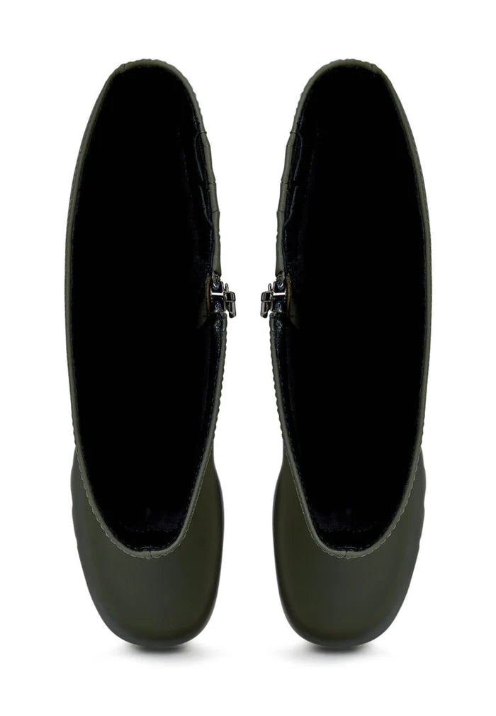 A trendy pair of knee-high chunky sole green boots, perfect for women's fashion footwear.