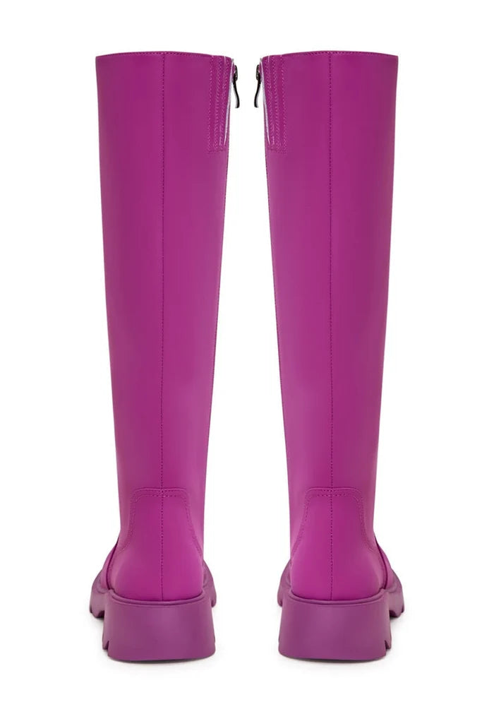 A trendy pair of pink knee-high boots with a chunky sole, perfect for women's fashion footwear.