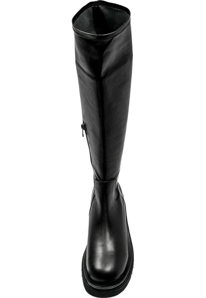 A stylish pair of women's knee-high leather lug boots, perfect for a fashionable and edgy look.