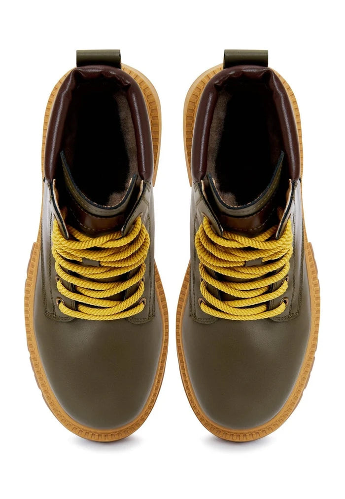 A stylish pair of green lace-up ankle boots, perfect for any trendy and fashionable outfit for women.
