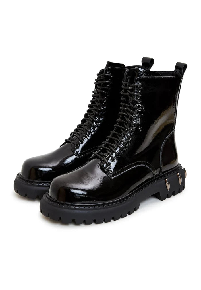 A pair of black lace-up combat boots with chunky soles, perfect for adding a touch of edgy style to any outfit.