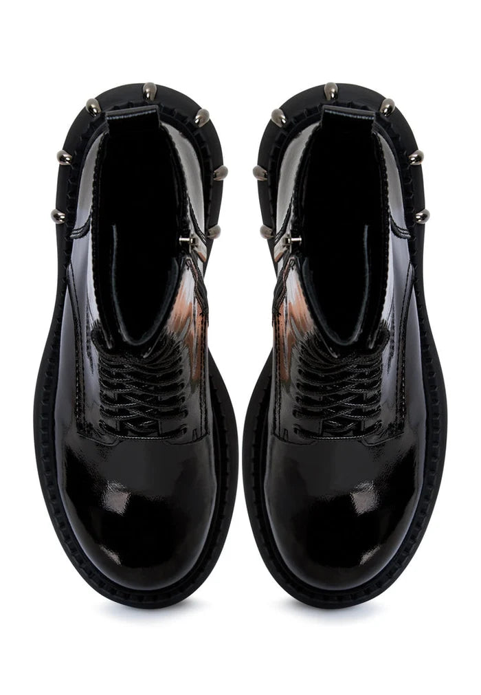 A pair of lace-up combat boots with a chunky sole in black, perfect for tough yet stylish looks.