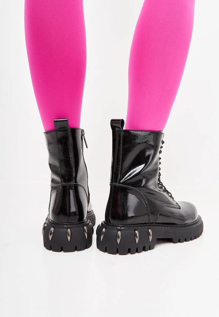 A stylish pair of black lace-up combat boots with a chunky sole, perfect for trendy and edgy street style looks.