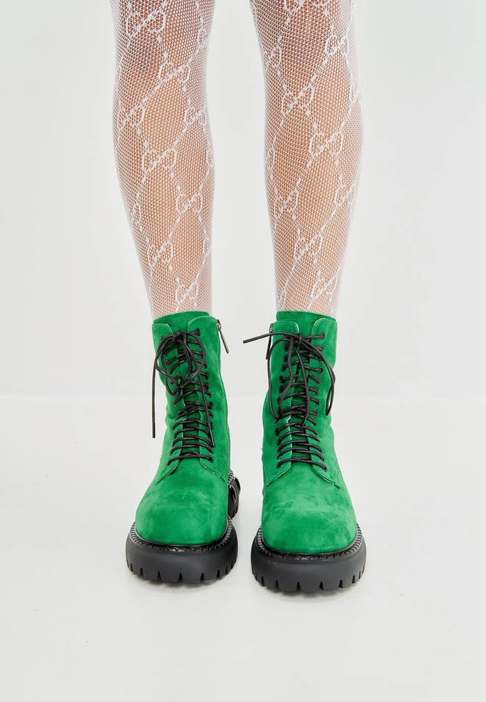 A trendy pair of lace-up combat boots with a chunky sole in green, perfect for those seeking military-style women's fashion footwear.