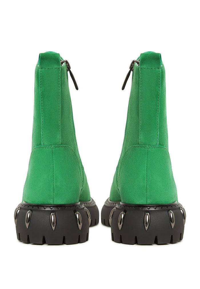 A stylish pair of green lace-up combat boots with chunky soles, perfect for women's military style fashion footwear.