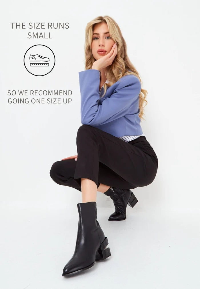 A stylish and chic pair of black leather ankle boots with a block heel for women.