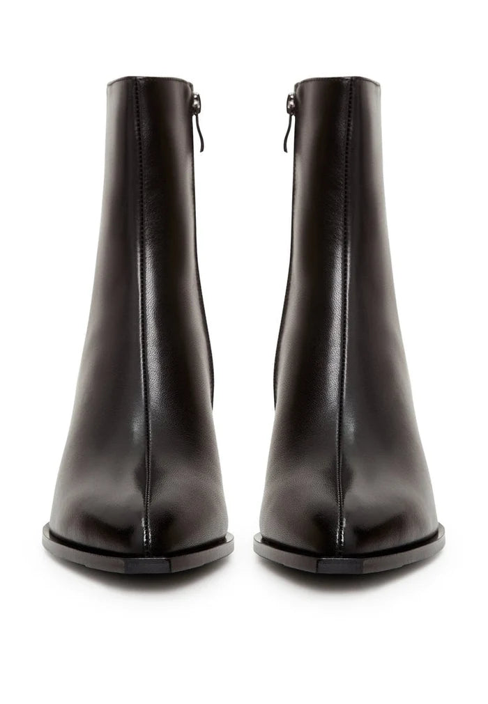 A pair of stylish black leather ankle boots with block heels, perfect for a fashionable woman's wardrobe.