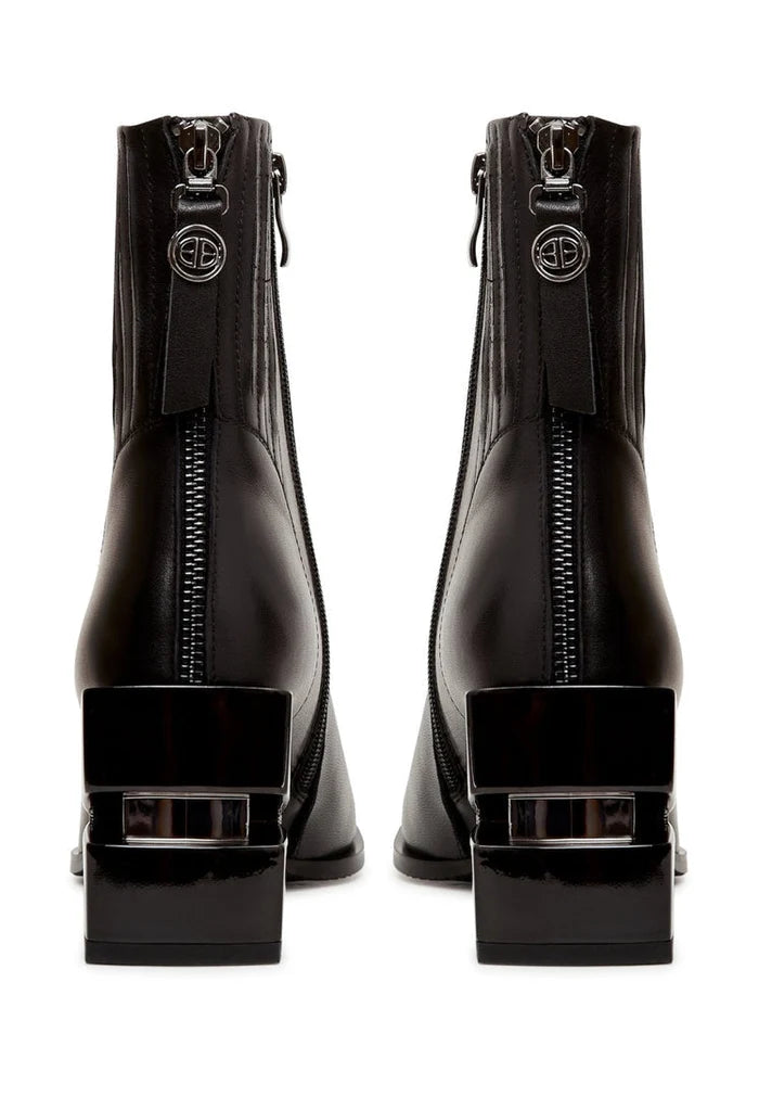 A stylish pair of black leather ankle boots with block heels for women.