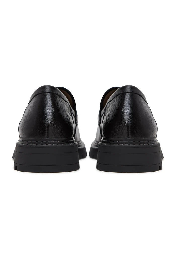 A fashionable pair of women's block heeled leather loafers, perfect for dressing up any outfit.