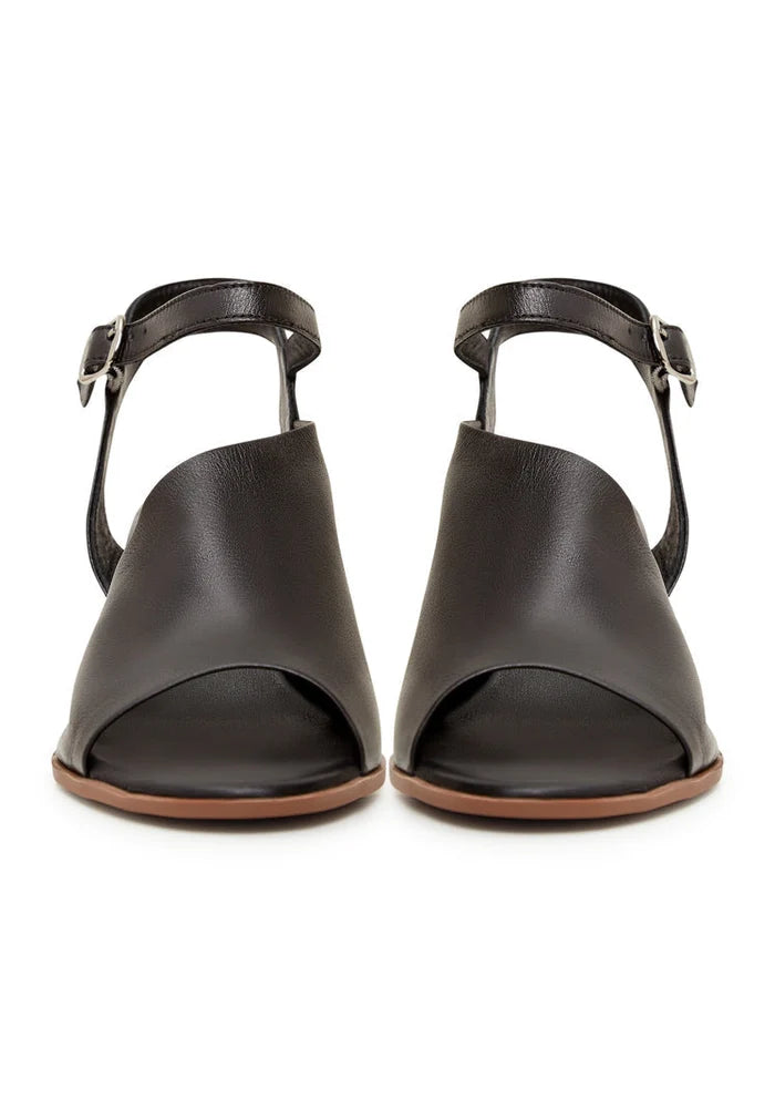 A stylish pair of black leather block heel sandals, perfect for adding a touch of sophistication to any outfit.