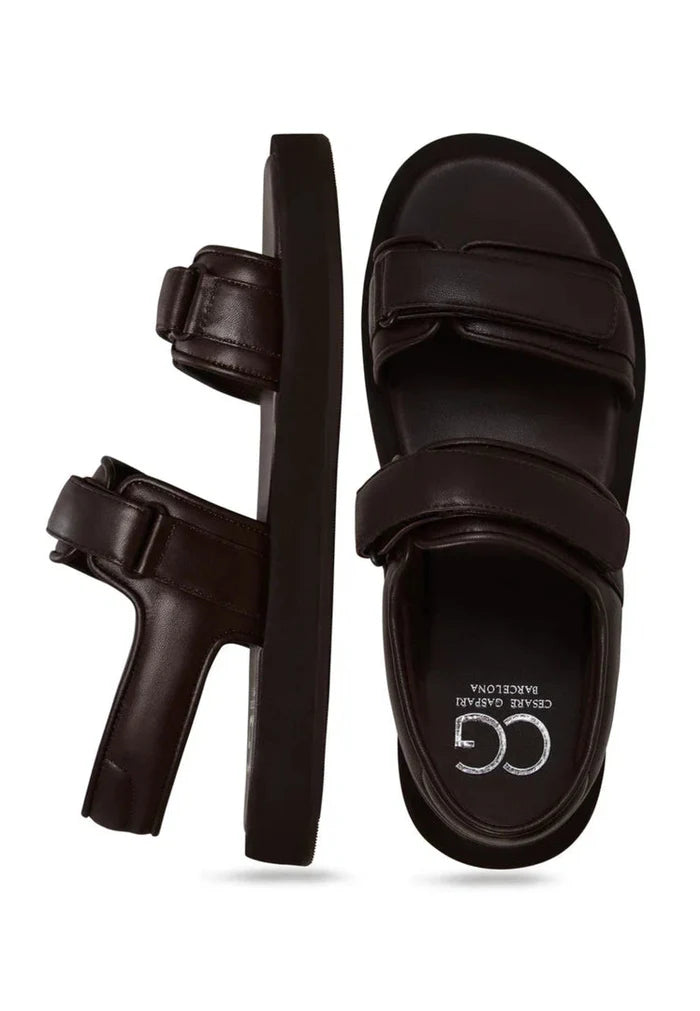 A stylish pair of women's dark brown leather sandals with Velcro closure for ultimate comfort and convenience.