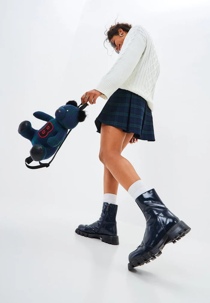 A stylish pair of women's blue leather ankle boots with a flat sole, perfect for a trendy and fashionable look.