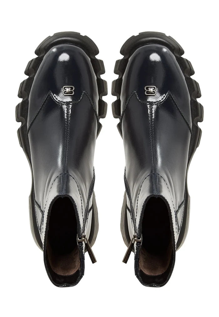 A trendy pair of women's leather ankle boots with a flat sole in a beautiful blue color.