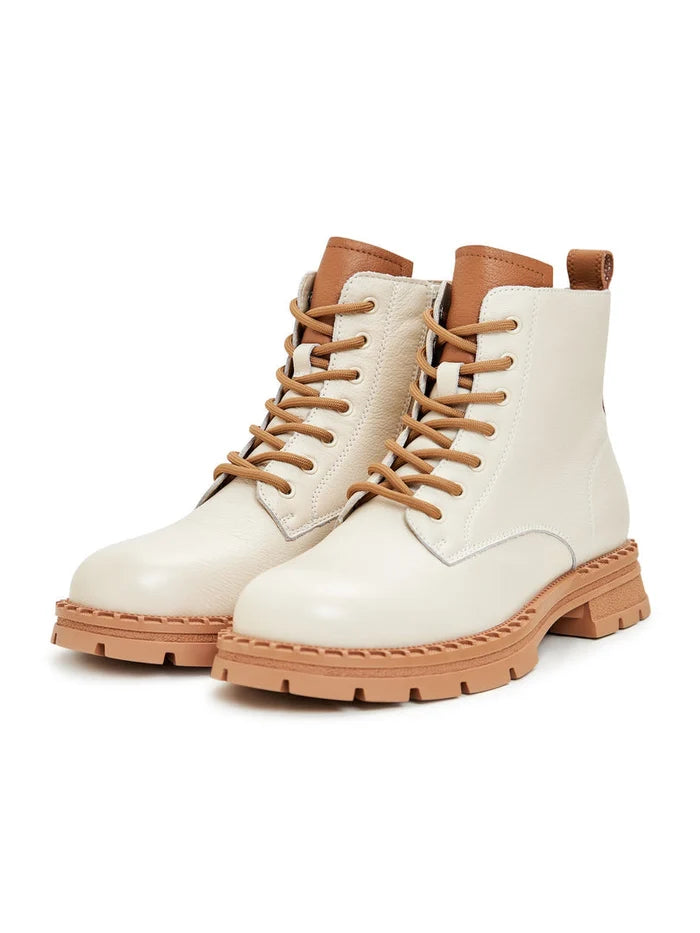 A stylish pair of off-white leather lace-up ankle boots for women, perfect for fashion-forward looks.