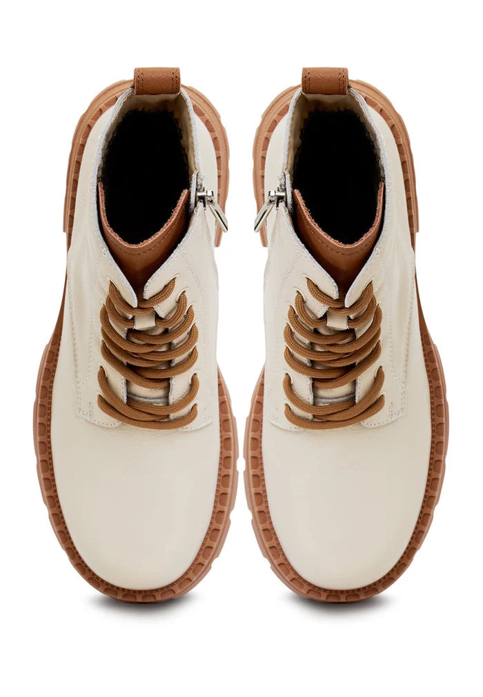 A stylish pair of lace-up leather ankle boots in off-white color, ideal for women's fashion and footwear.