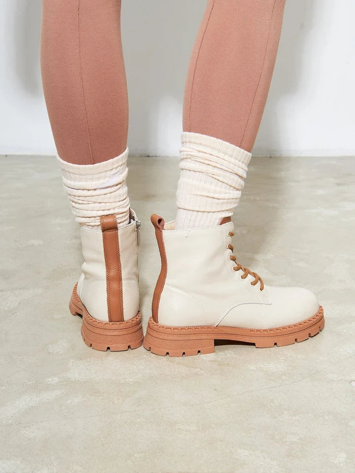 A stylish pair of women's off-white leather lace-up ankle boots - must-have fashion boots for your collection.