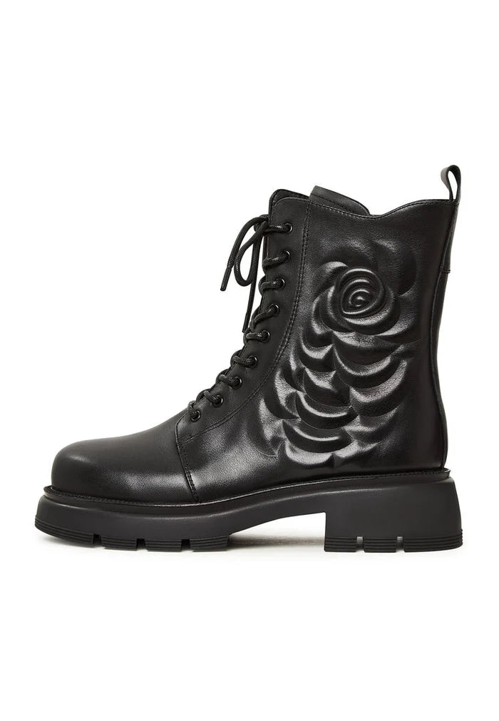 A stylish pair of black leather platform ankle boots for women, featuring a high heel and a fashionable design.