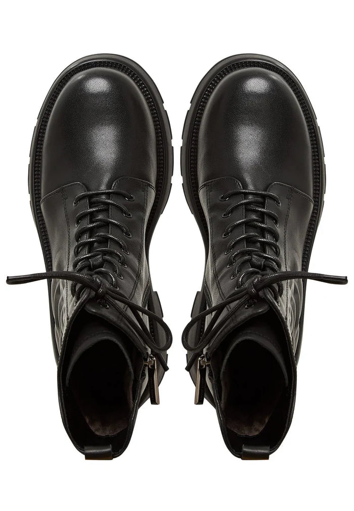 A pair of fashionable women's black leather platform ankle boots with high heels.