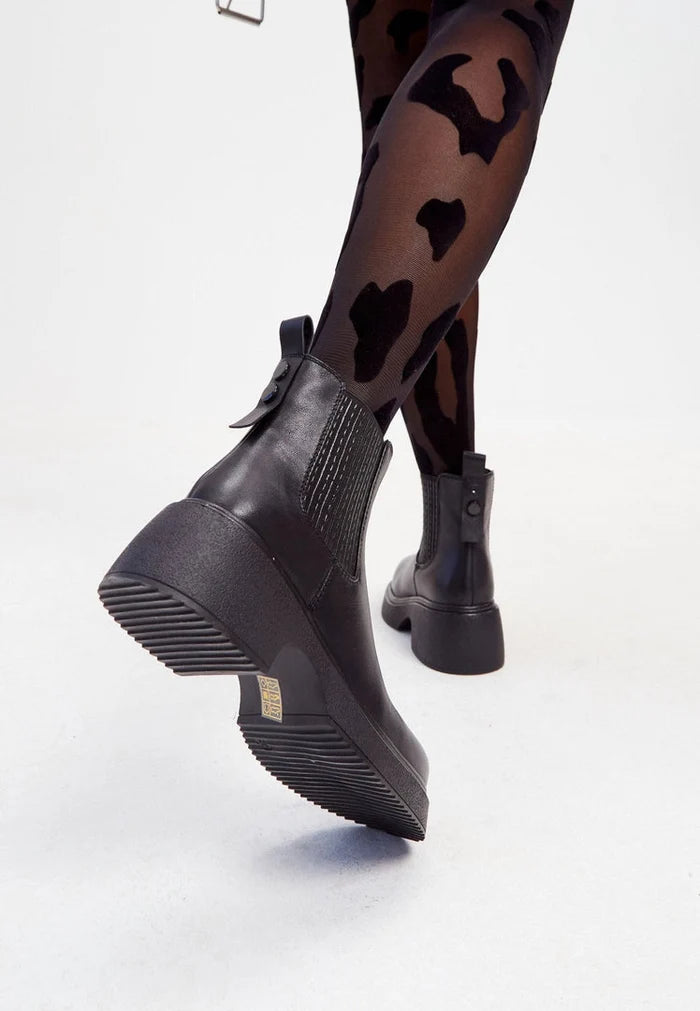A stylish pair of black leather platform ankle boots for women, featuring high heels and a fashionable design.