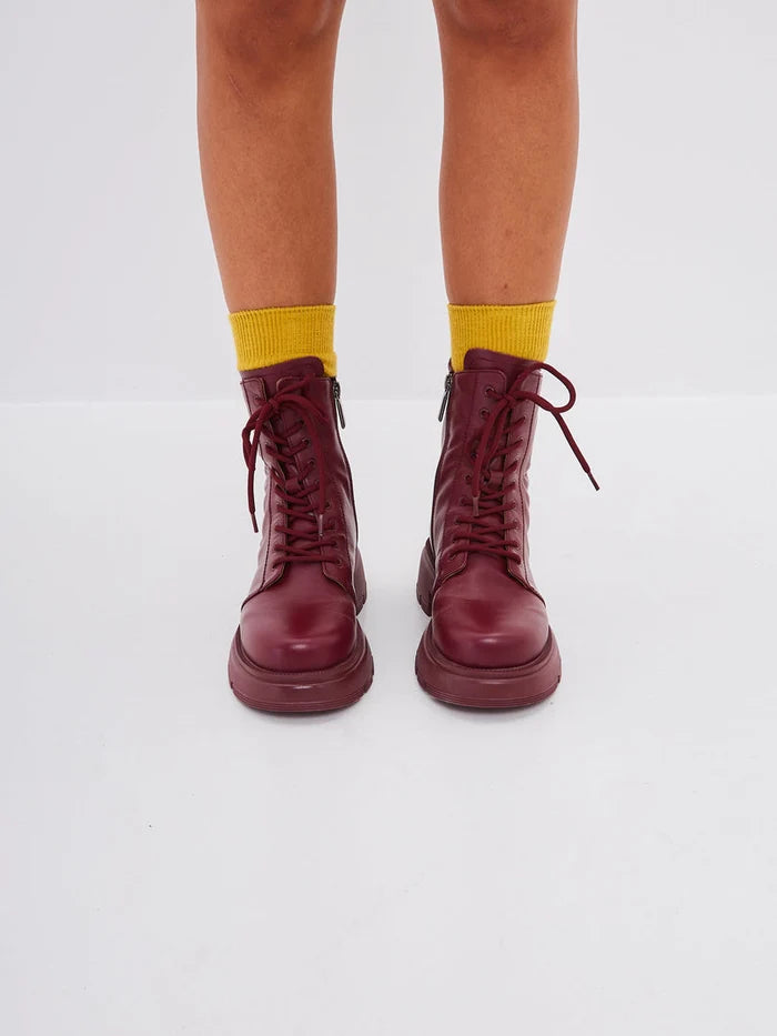 A stylish pair of bordeaux leather platform ankle boots, perfect for adding a touch of sophistication to any outfit. These high heel ankle boots are a must-have for any fashion-forward woman's collection of fashionable ankle footwear.