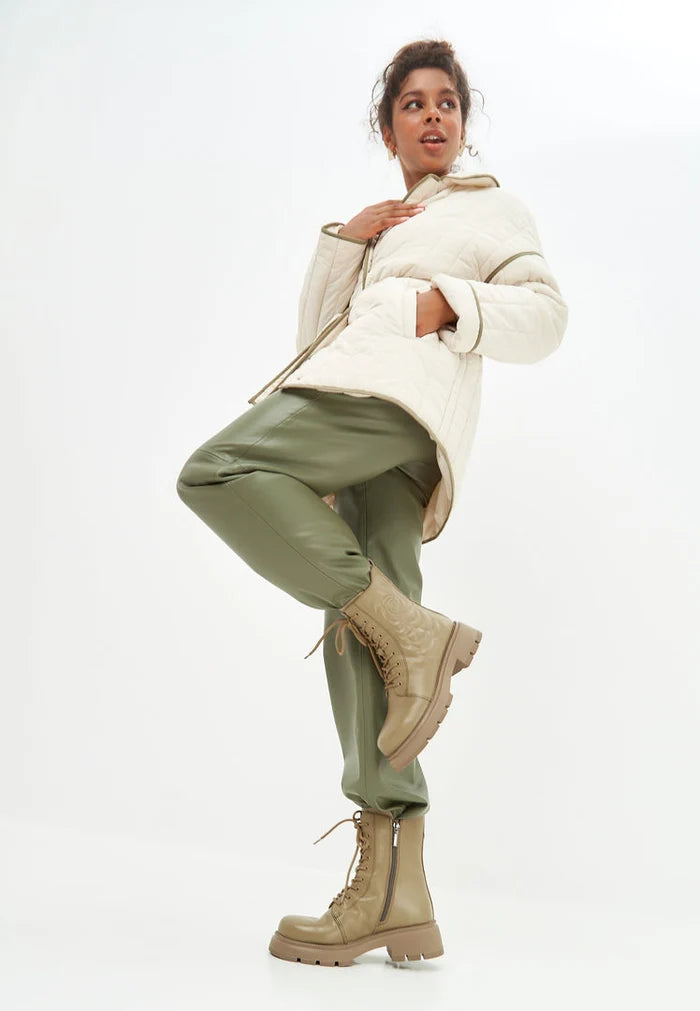 A stylish pair of green leather platform ankle boots, perfect for making a bold fashion statement.