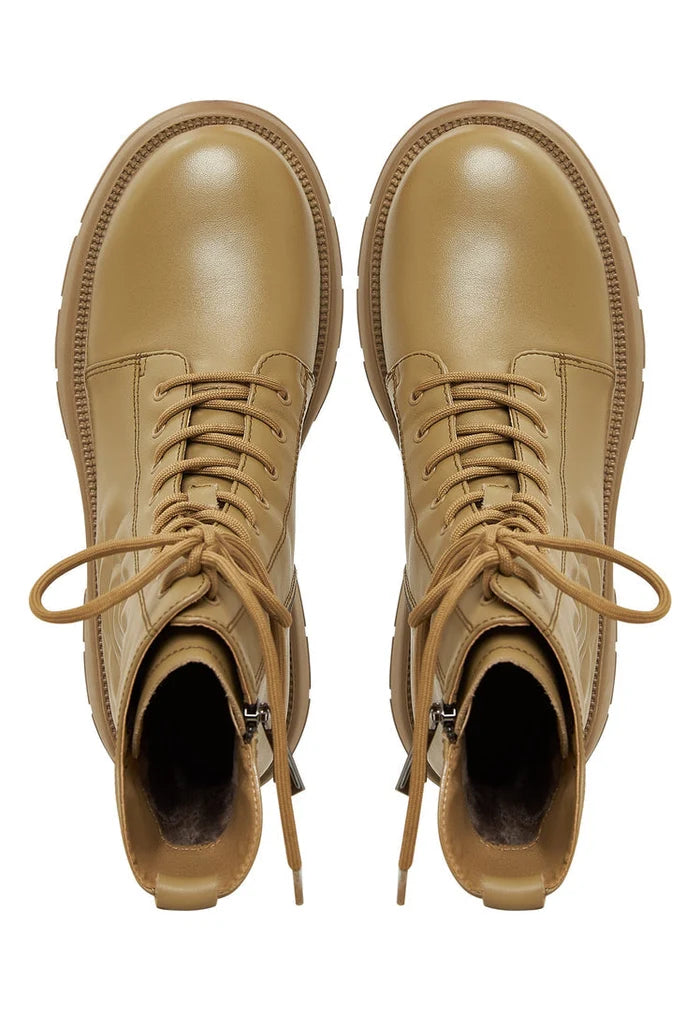 A stylish pair of green leather platform ankle boots, perfect for adding a pop of color to any outfit.